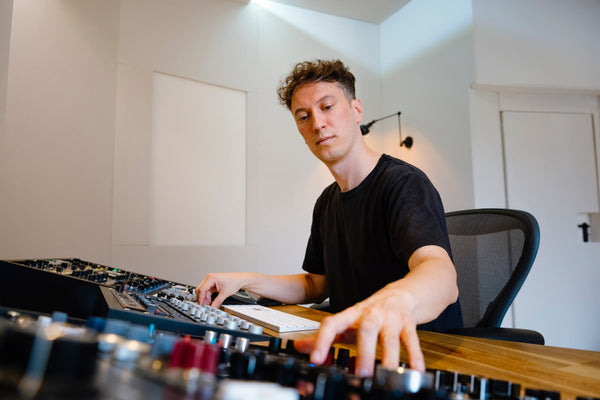 Mastering engineer at Schaltgeraete Studios operating a VCA compressor